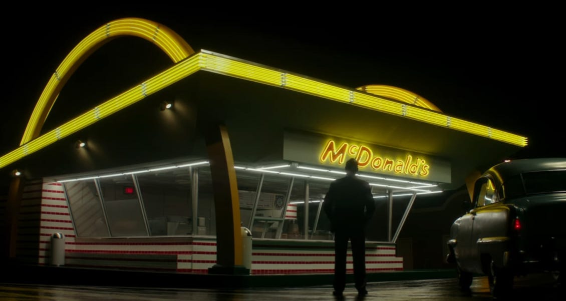 Ray Kroc stands outsides a McDonald's resturaunt in this image from the 2016 movie The Founder