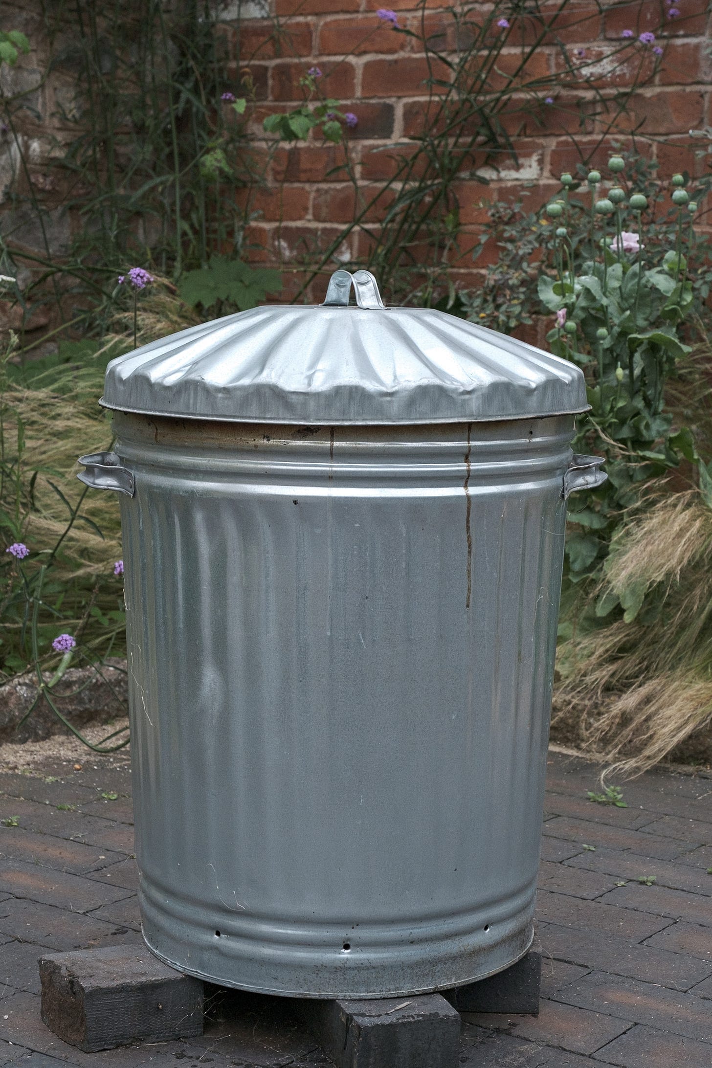 Galvanised lidded dustbin used for smoking ceramics