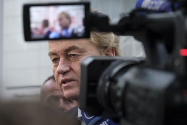 Geert Wilders, leader of the Party for Freedom, known as PVV, speaks to media after casting his ballot in The Hague, Netherlands, Wednesday, Nov. 22, 2023. Dutch voters cast ballots in a general election that will usher in a new prime minister for the first time in 13 years, with the rising cost of living and migration topping electoral concerns in a country that plays an important role in EU affairs and global trade and tourism.(AP Photo/Mike Corder)