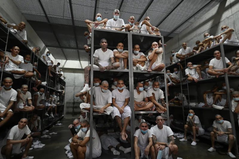 Inmates sit in a cell at the Terrorist Confinement Center in Tecoluca, El Salvador, on Jan. 27.