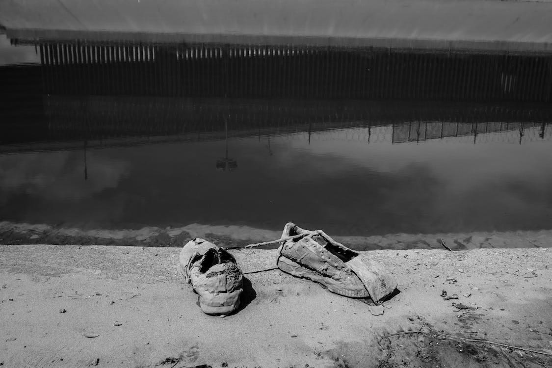 Free Grayscale Photo of Decaying Shoes Stock Photo