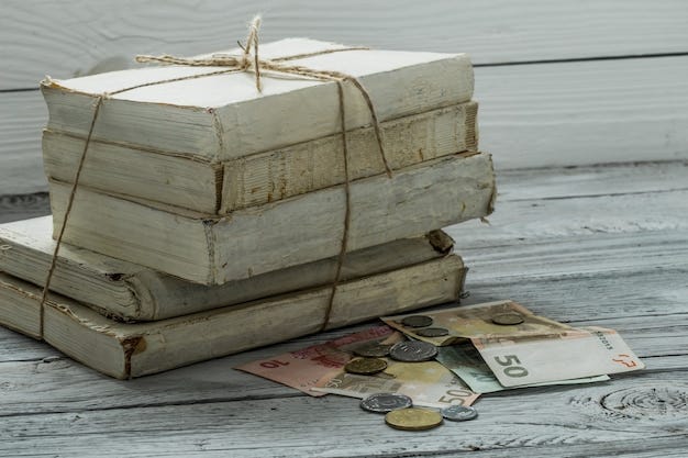 Free photo old white books with money and coins on wooden wall