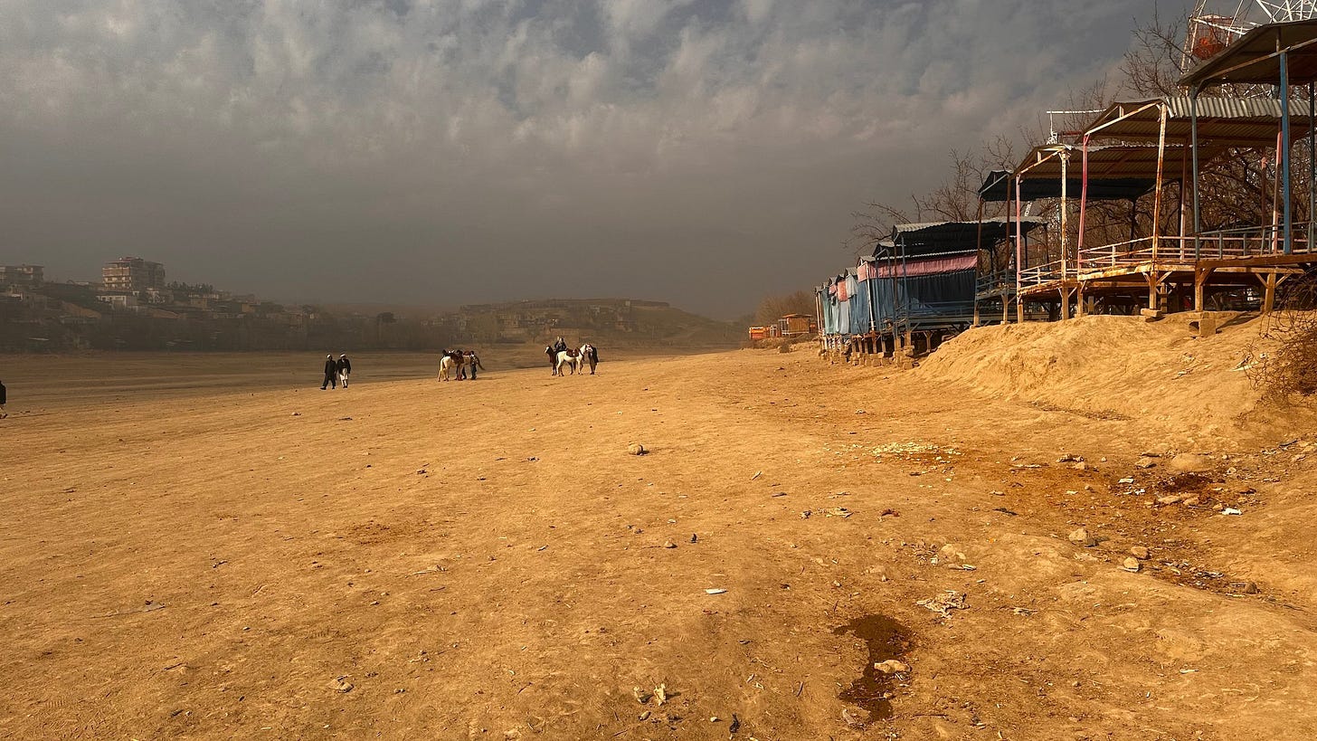 <p>Restaurants near Qargha Lake, Afghanistan, sit on what used to be the lake shore. In the past three years, the surface area of the lake has shrunk by nearly two-thirds due to droughts. (Image: Undark)</p>