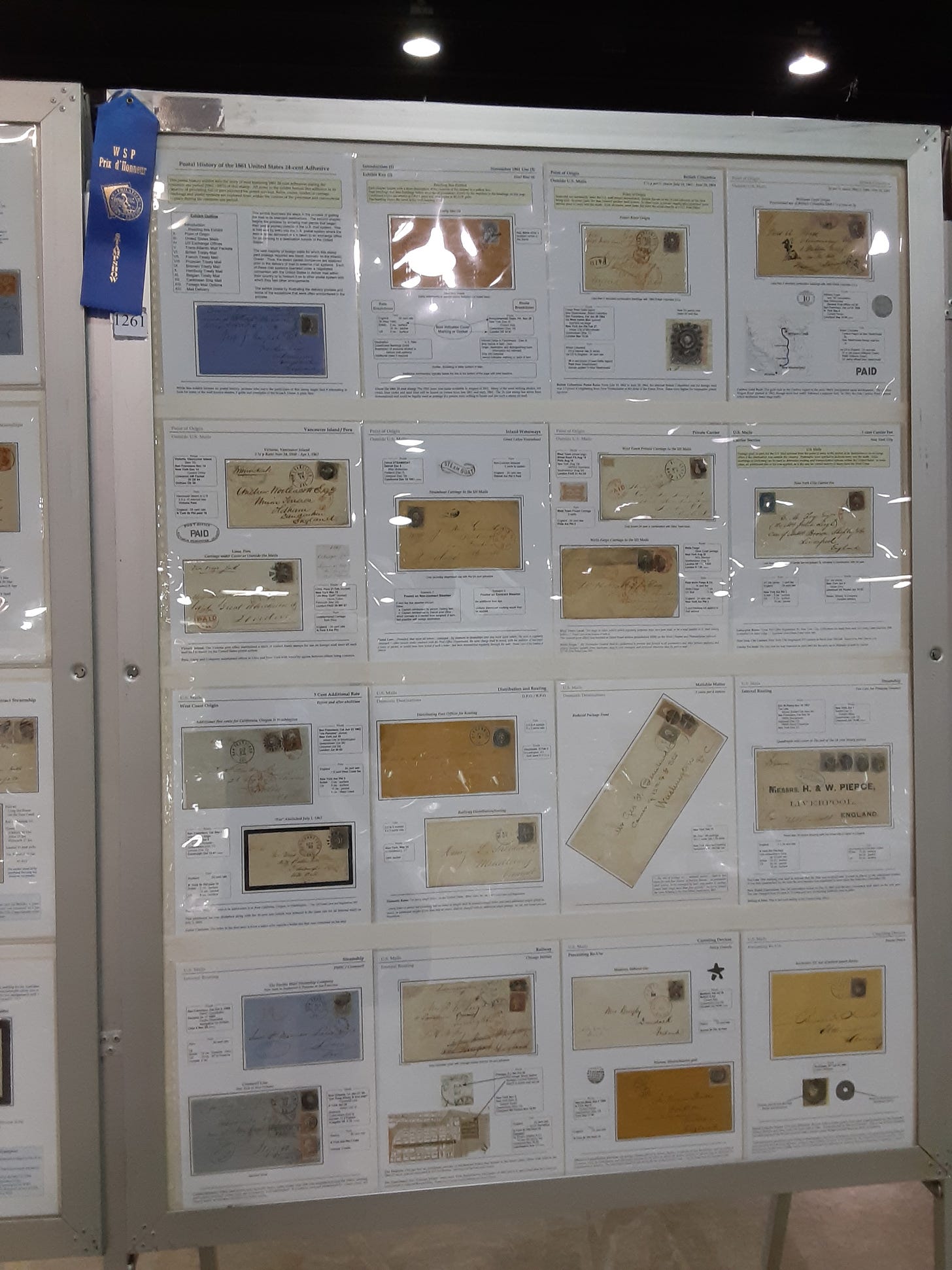 postal history exhibit in frame at a show
