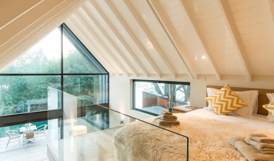 bright and airy bedroom positioned on a mezzanine floor