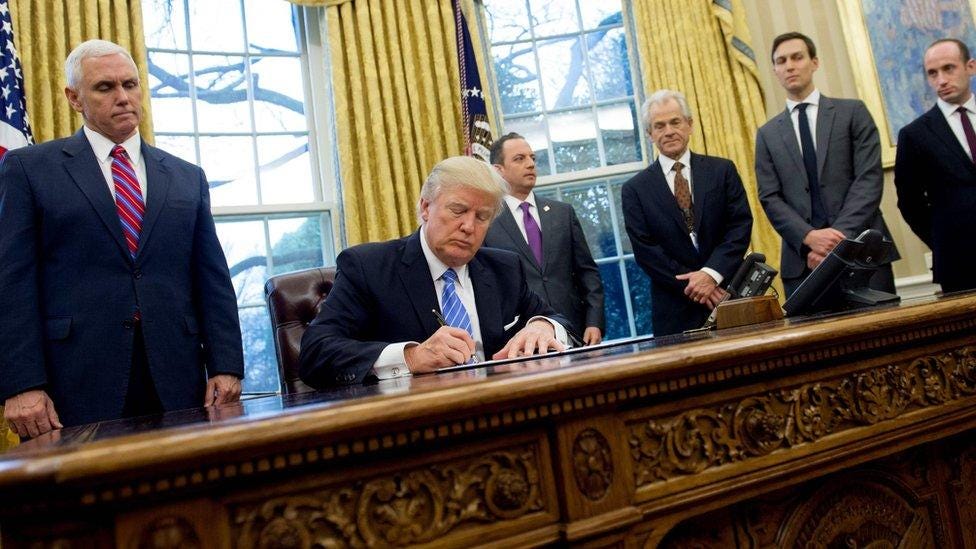 US President Donald Trump signing executive orders in the Oval Office US President Donald Trump signing executive orders in the Oval Office