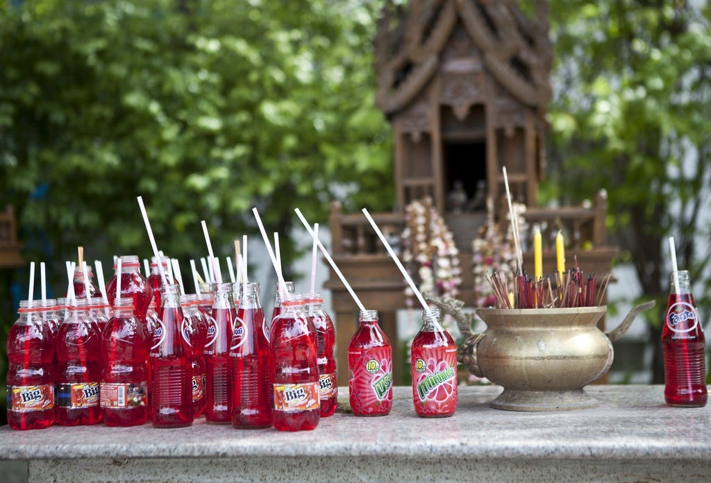 Why do Thai spirit houses have Red Fanta as offerings? | by Orana Velarde |  Medium