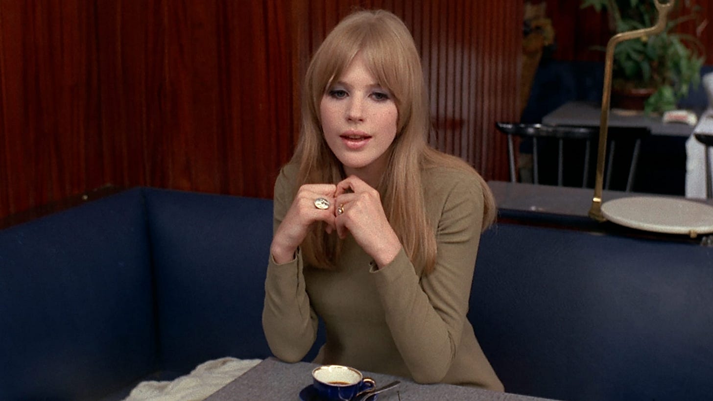 Marianne Faithfull, looking angelic in a taupe turtleneck and blonde hair, singing "As Tears Go By" in a cafe in Godard's movie "Made in the USA"