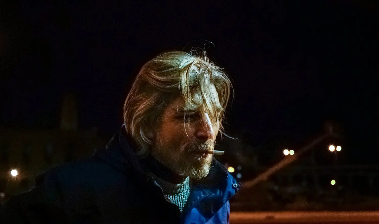 Knausgaard smoking a cigarette