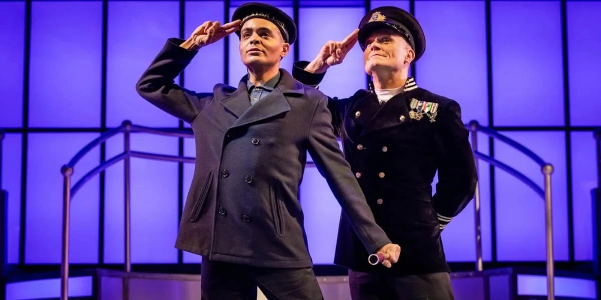 Actors Layton Williams (the Iceberg) and Darren Bennett (Victor Garber / Luigi) give a salute on the bow of the Titanic. Actors Layton Williams (the Iceberg) and Darren Bennett (Victor Garber / Luigi) give a salute on the bow of the Titanic.