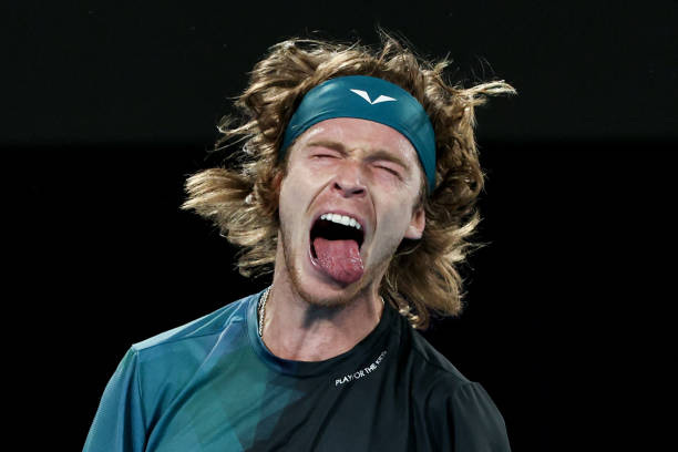 Russia's Andrey Rublev reacts against Australia's Alex De Minaur during their men's singles match on day eight of the Australian Open tennis...