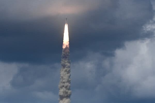 A spacecraft leaves a flume of smoke and fire as it enters a mass of clouds.