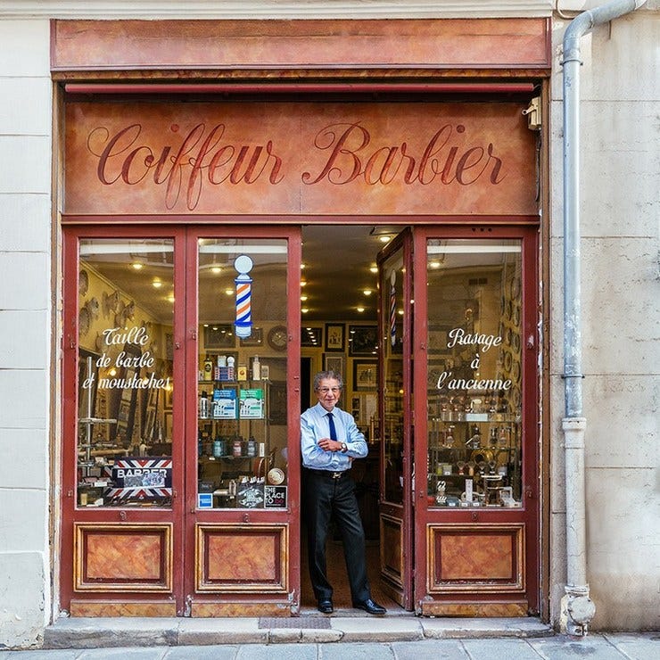 Alain at the door of his barbershop, the most famous in Paris.