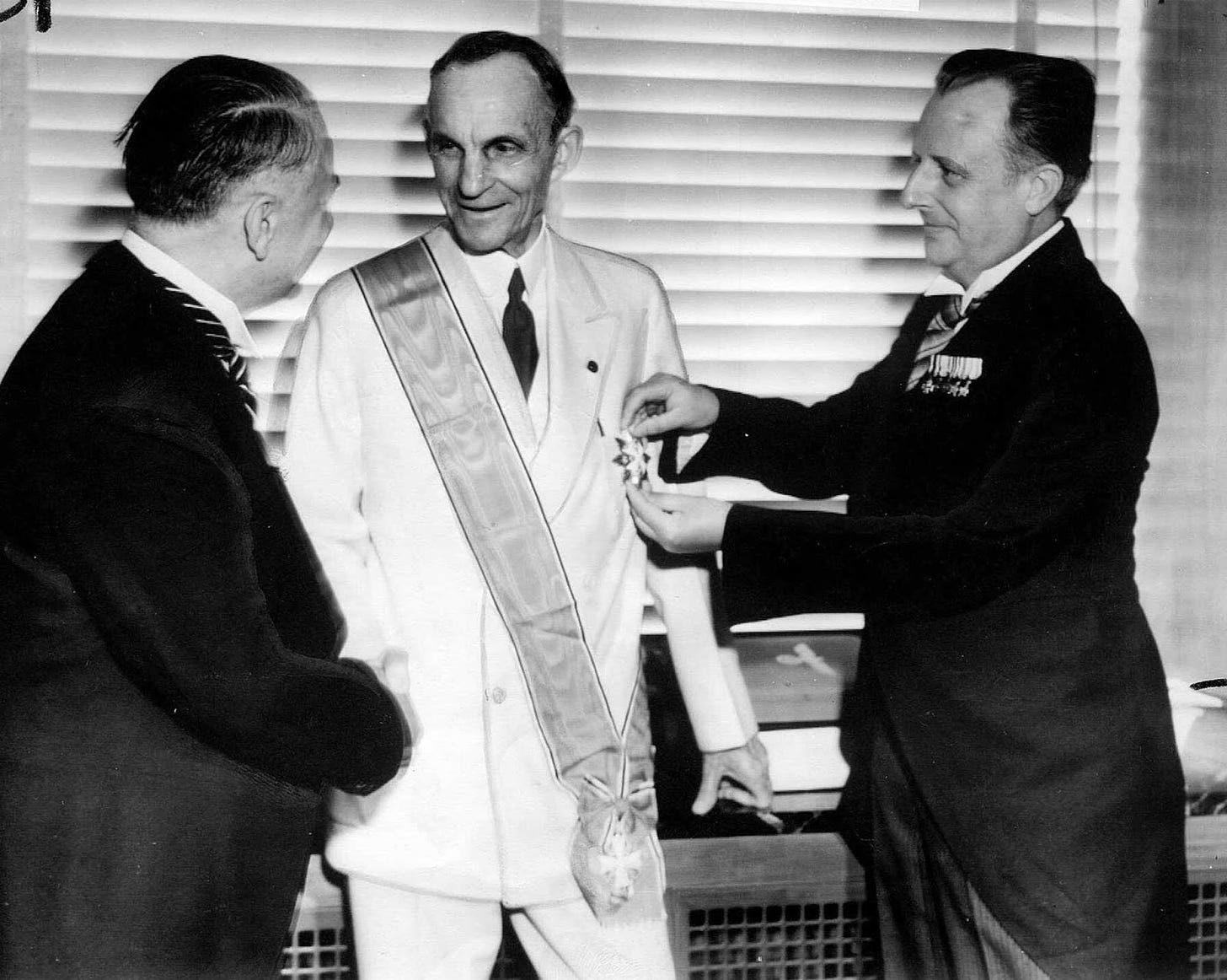 Henry Ford receiving the Grand Cross of the German Eagle from Nazi officials, 1938.