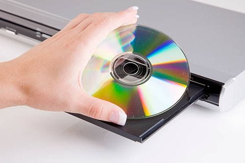 hand holding cd/dvd - dvd player stock pictures, royalty-free photos & images