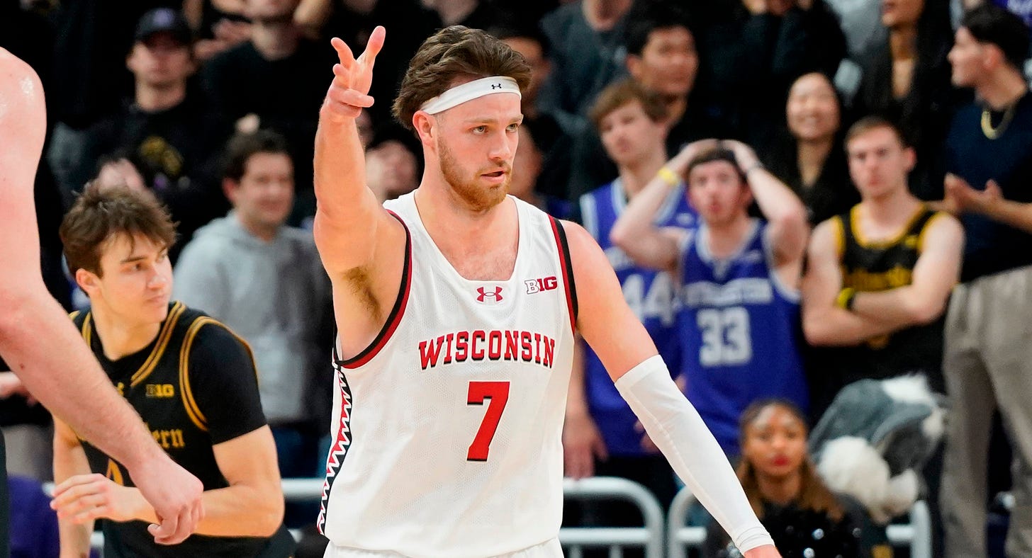 Wisconsin Badgers forward Carter Gilmore (7) gestures after a made three point basket