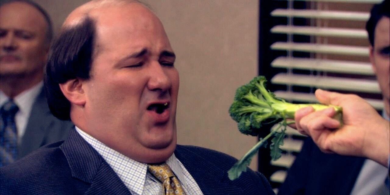 Kevin in The Office facing down a big hunk of broccoli.