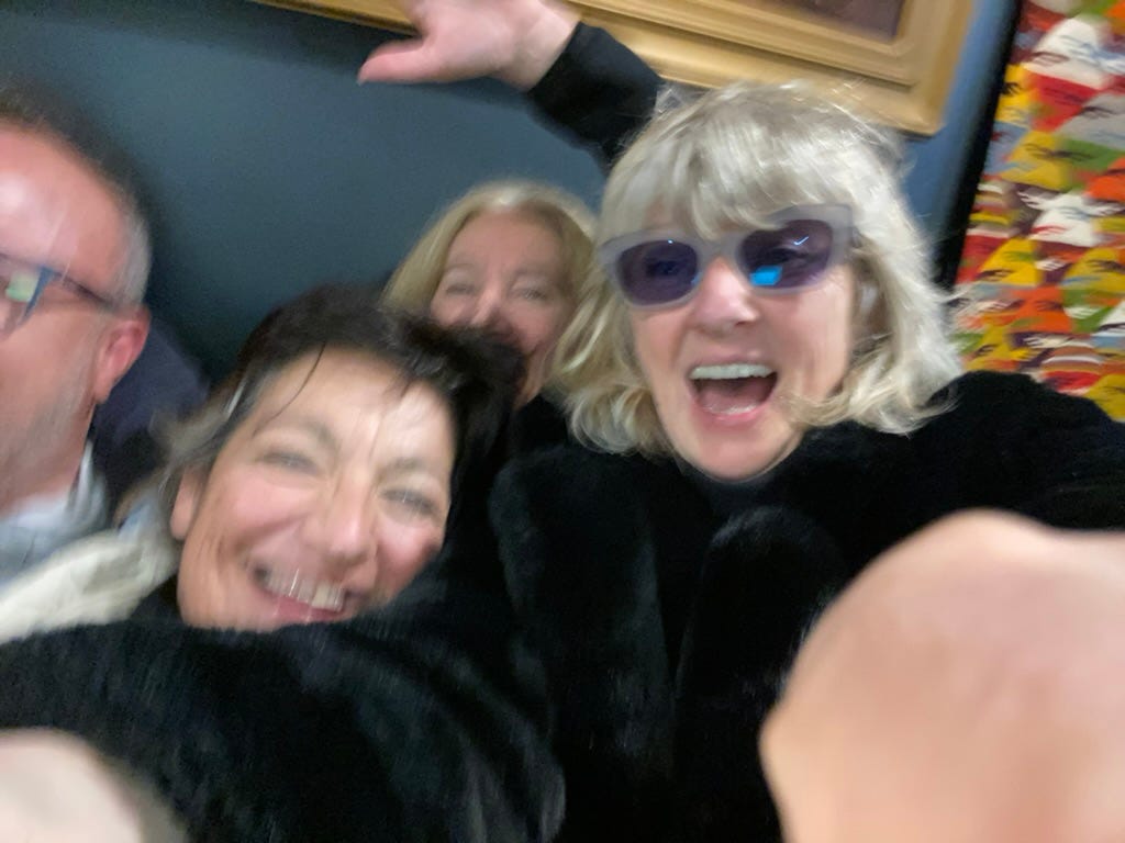 Slightly blurred selfie of ladies laughing