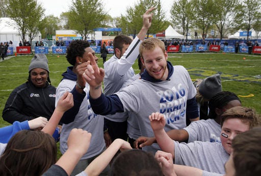 Carson Wentz with kids nfl draft day