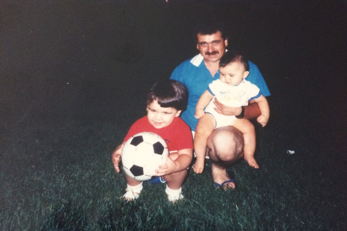 Me with my dad and little brother at a park as a kid.