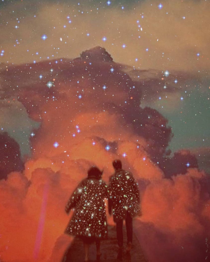 A couple in starlight jackets walking up a starlit path