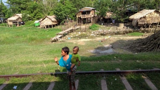 Kids waving at the train