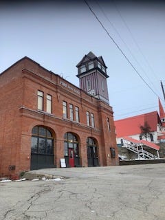 An old red brick firehall and tower in Rossland, BC