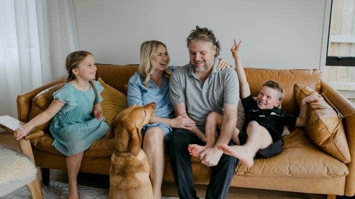 Jana and Hamish MacPherson with their children River, 7, and Hunter, 8, and pet dog Hudson, two weeks before Hamish died from cancer.