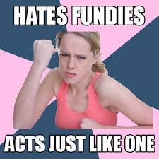 Woman in tank top holds up her fist in a boxing stance against a pink and blue background. Caption: Hates Fundies. Acts Just like One.