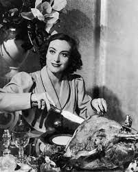 Vintage Annals Archive on Instagram: "Actress Joan Crawford carving a turkey  for a publicity photo. Apparently, this was quite a common pose for actors  in the 30s and beyond #joancrawford #thanksgiving #thanksgiving2020"