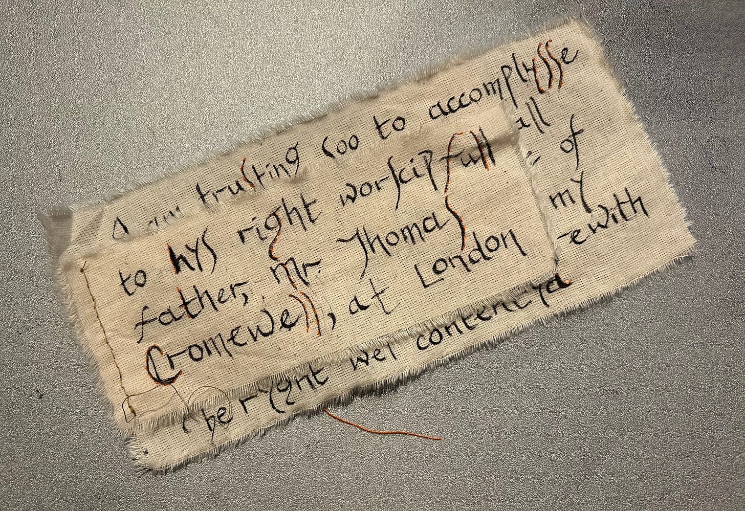 Stitched and inked small piece representing a letter from Gregory Cromwell. The text reads “to his right worshipful father Mr Thomas Cromwell at London”