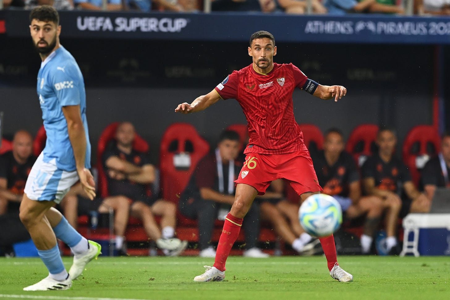 Jesus Navas pictured (right) playing for Sevilla against former club Manchester City in the 2023 UEFA Super Cup final