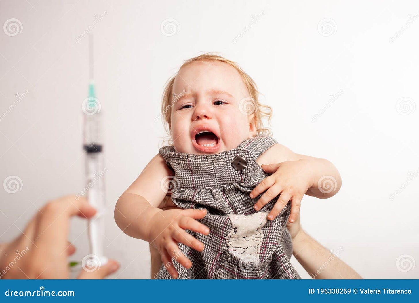 The Child is Afraid of a Syringe, the Girl Yells and Does Not Want To ...