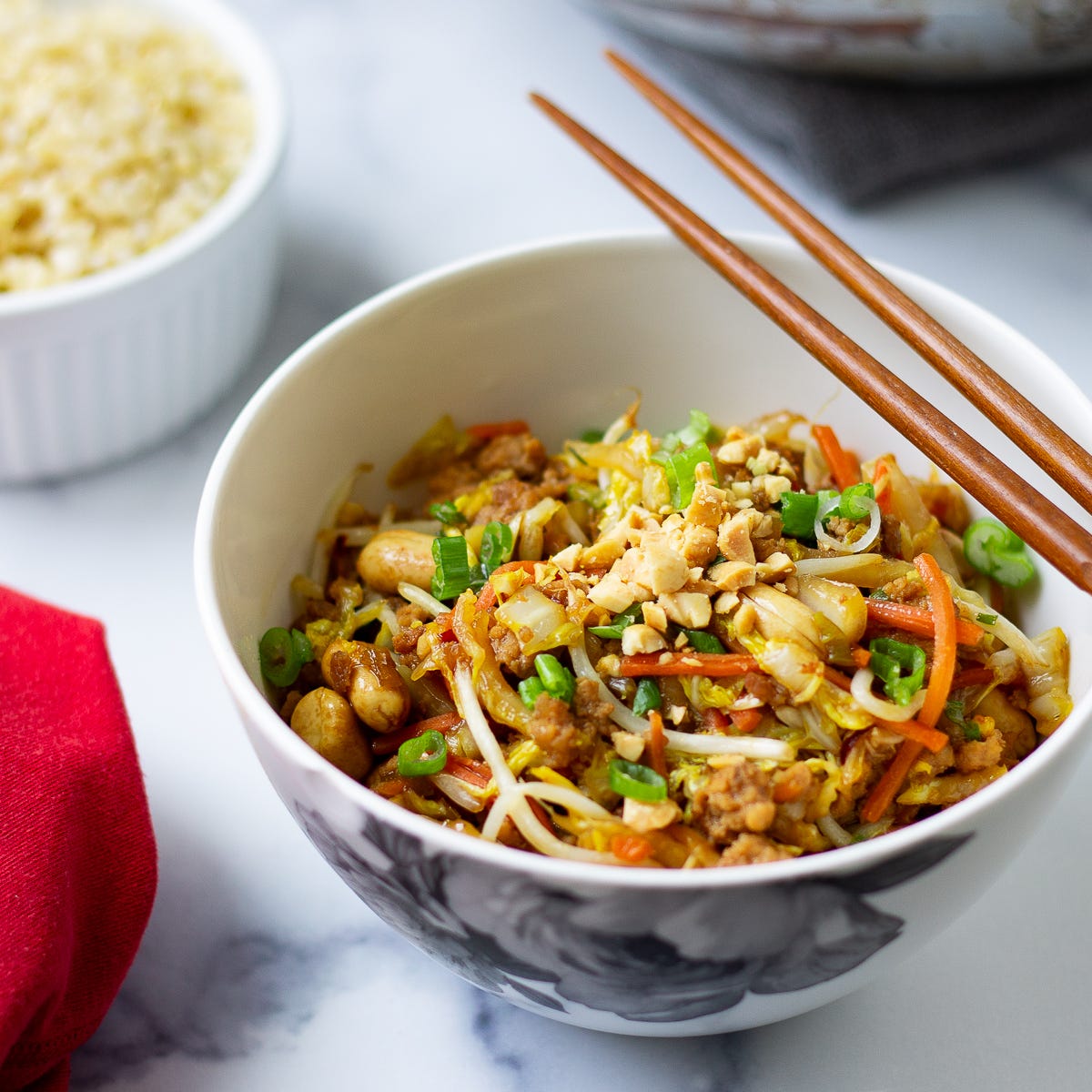 Cabbage and pork stir-fry with peanuts in a bowl. 