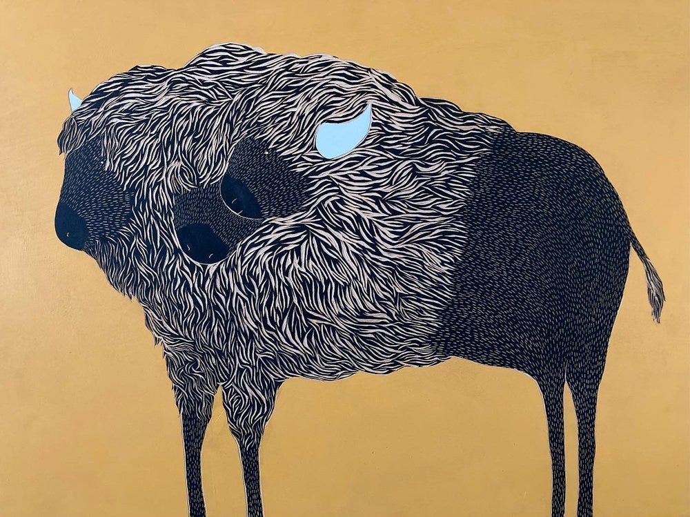 buffalo with three heads against gold background