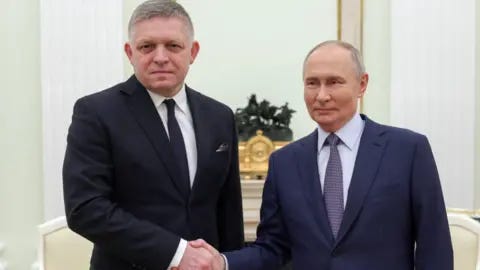 EPA Russian President Vladimir Putin (R) shakes hands with Slovak Prime Minister Robert Fico (L) during their meeting at the Kremlin in Moscow