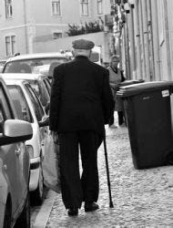 Elderly man walking alone