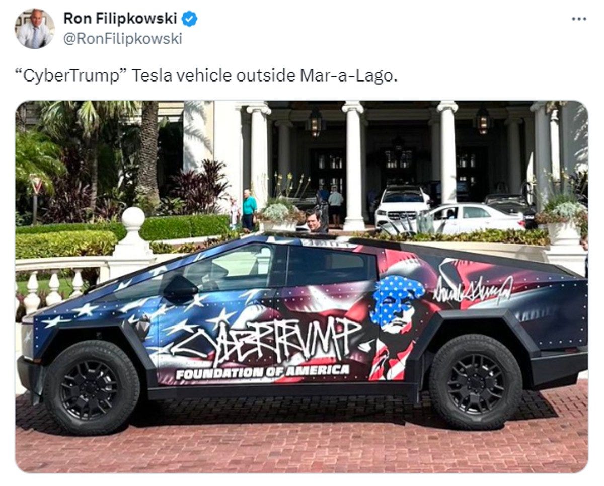 Cybertruck with Trump's face painted on it and CYBERTRUMP written on it.