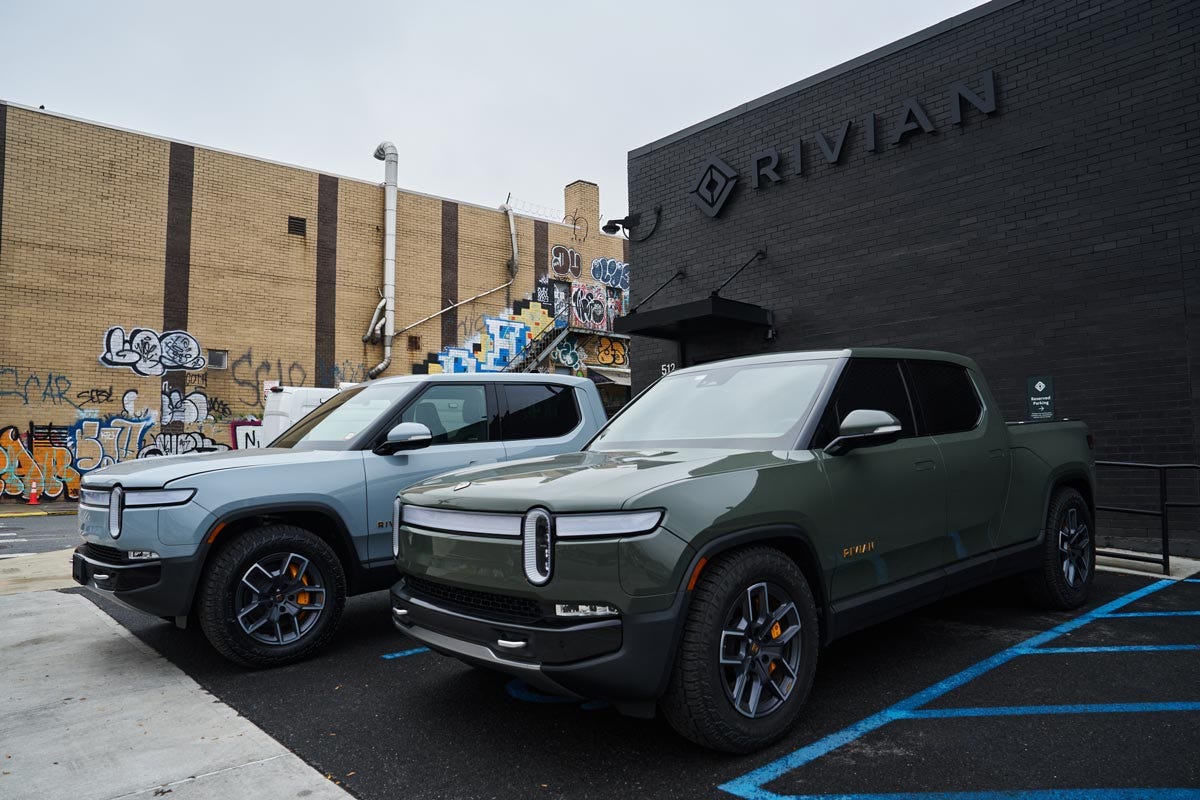 Rivian R1T electric pickup trucks parked at a Rivian service center in Brooklyn, New York, in 2023.