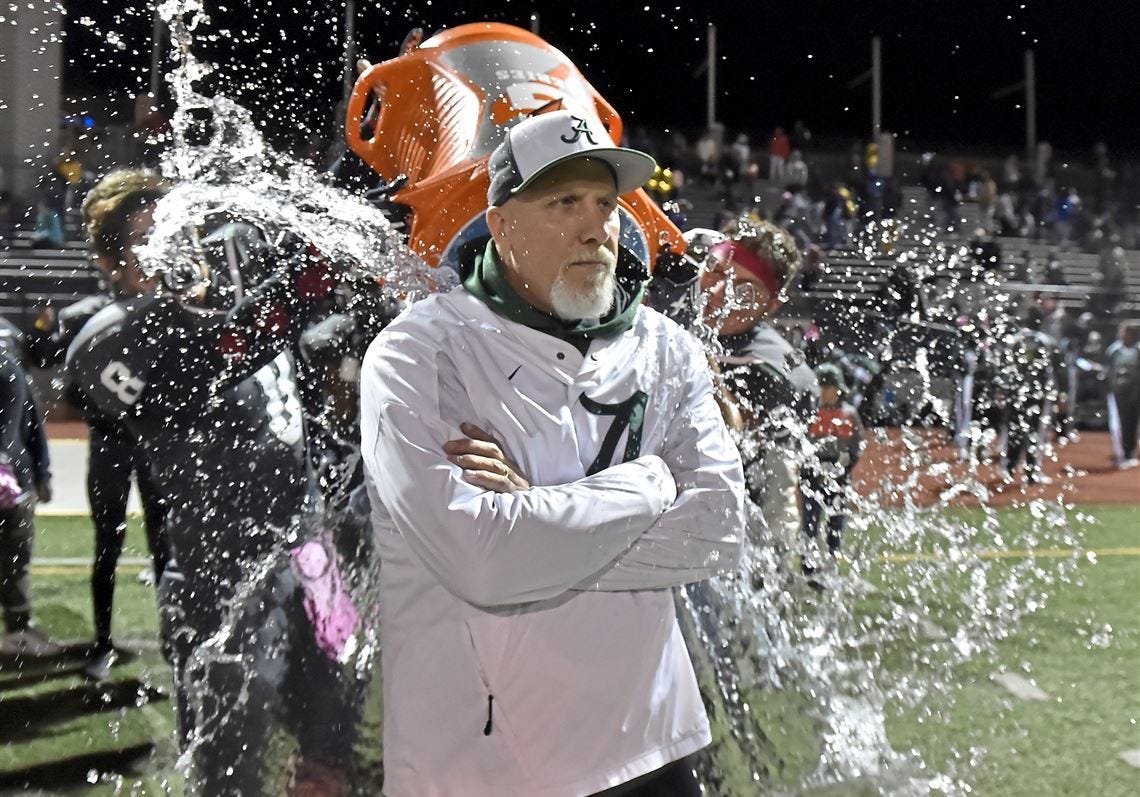 Allderdice teammates pour Gatorade over head coach Jerry Haslett after defeating Westinghouse in the City league championship Tuesday, Oct. 30, 2018, at Cupples Stadium.