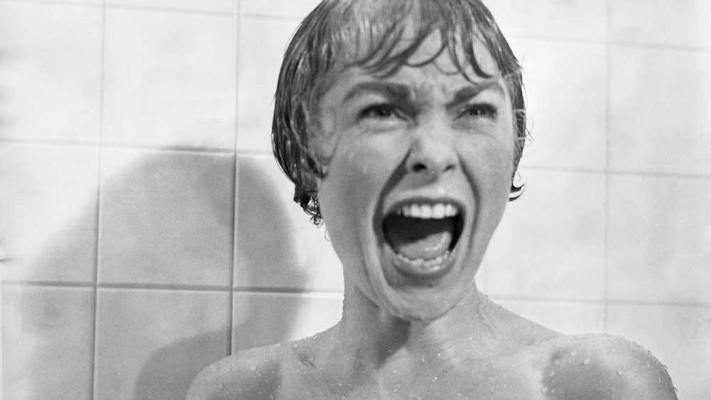 A woman screams in Alfred Hitchcock's Psycho