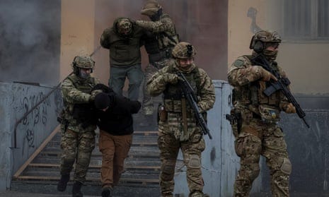 Ukrainian servicemen attend a joint drills of armed forces, national guard and Security Service of Ukraine (SBU) near the border with Belarus.