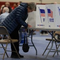 A voter fills out their New Hampshire presidential primary ballot at a polling location in Bedford on Jan. 23.