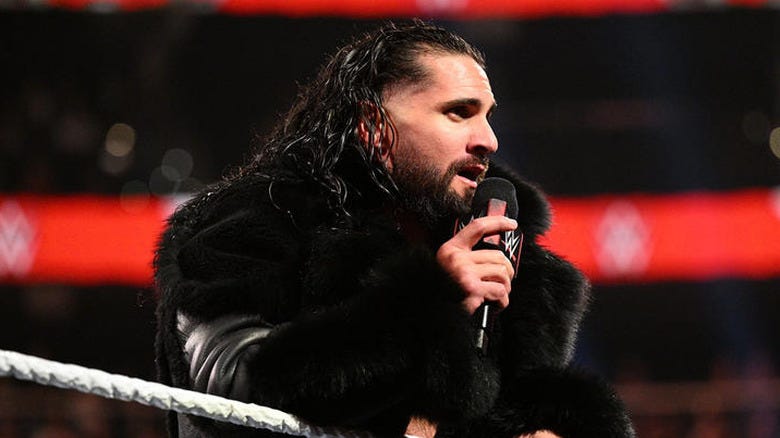Seth "Freakin" Rollins speaking into a microphone on "WWE Raw"