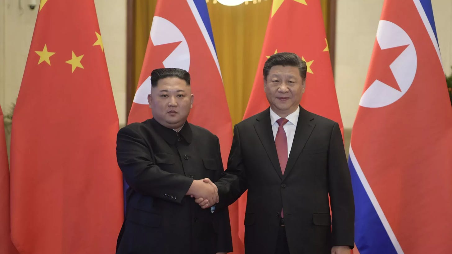 In this Tuesday, Jan. 8, 2019, photo released by China's Xinhua News Agency, North Korean leader Kim Jong Un, left, and Chinese President Xi Jinping shake hands as they pose for a photo before talks at the Great Hall of the People in Beijing - Sputnik International, 1920, 09.09.2024