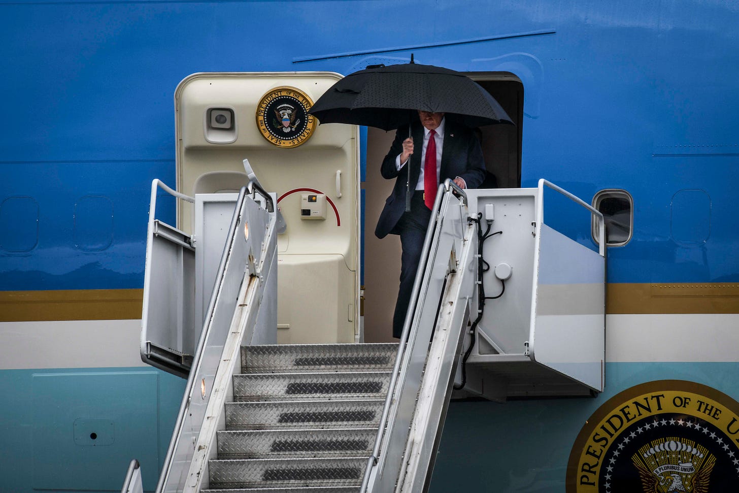 250209-N-LX838-1183 NEW ORLEANS (Feb. 9, 2025) President Donald Trump arrived at Naval Air Station Joint Reserve Base (NAS JRB) New Orleans on his way to Super Bowl LIX at the Caesars Superdome. Capt. Andrew McGinly, the commanding officer of NAS JRB New Orleans, was on hand to greet the President and his family before their departure. (U.S. Navy photo by Mass Communication Specialist 1st Class Steven Edgar)