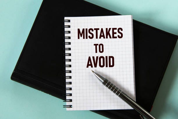 Mistakes To Avoid Words In A White Notebook Against The Background Of A  Black Notebook With A Pen Stock Photo - Download Image Now - iStock