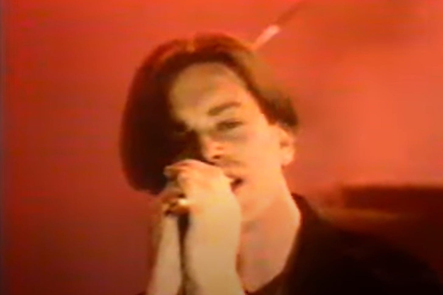Close-up of Dave Jackson, clutching a microphone. Screengrab from video of Old Grey Whistle Test performance.
