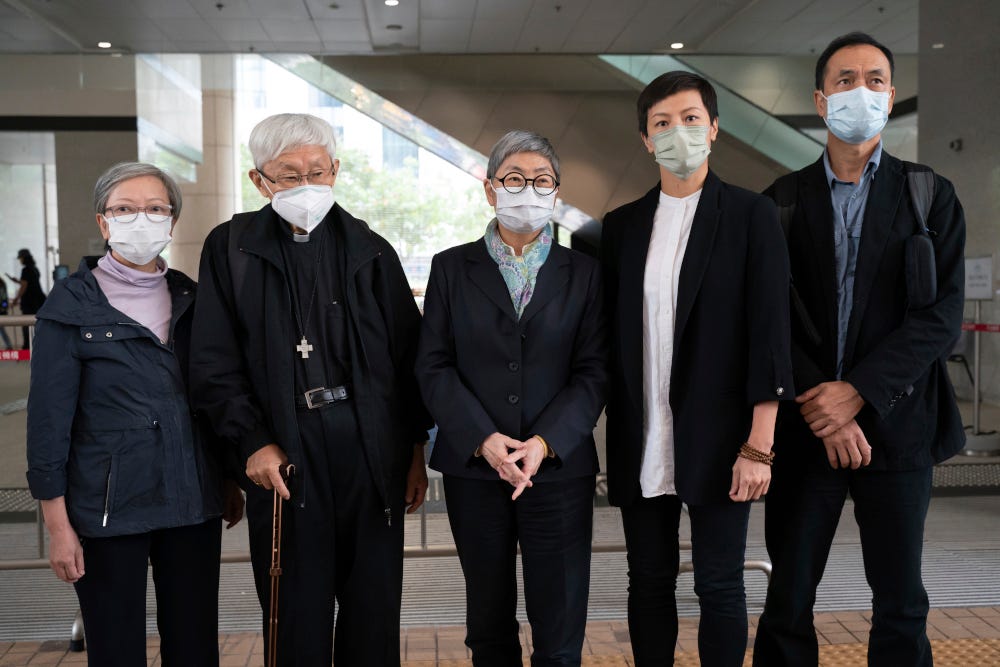 From left, former lawmaker Cyd Ho, Cardinal Joseph Zen, barrister Margaret Ng, singer Denise Ho and scholar Hui Po-keung pose for a photograph outside of the West Kowloon Magistrates's Courts