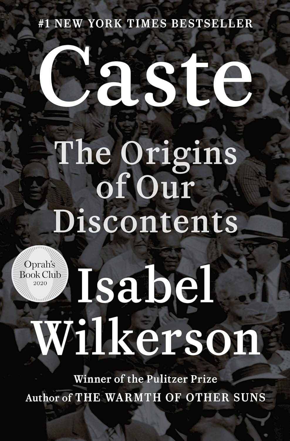 The book cover of “Caste” shows a photo of a crowd of Black and White people.